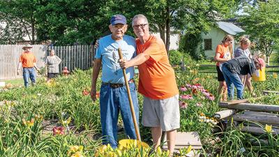 Carroll Wrather and his son, Dale Wrather, at last year’s daylily sale.