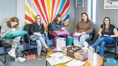 From left, Arianna Weisser, Brianna Dennis, Arie Fletcher, Giuli Gasior and co-founder of Atlas Youth Outreach and director of clinical programs Annie Caputa at one of Atlas’ support groups.