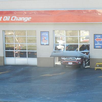 SUV crashes through bay door of Festus Valvoline garage