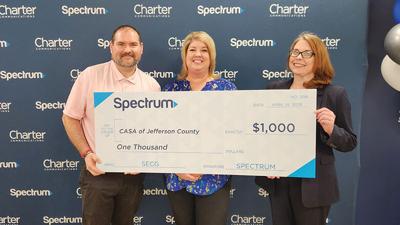 Pictured with check: Tony Hunt, advocate supervisor for CASA, Alicia Knickman, executive director for CASA; and Mary Ulrich, Charter facilities maintenance specialist and CASA volunteer.