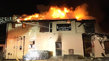 A 105-year-old building on Old Lemay Ferry that used to house Sally's Place was destroyed by fire Sunday.