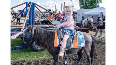 Hayden Erxleben, 3, of House Springs rides a pony at the Jefferson County Rodeo.
