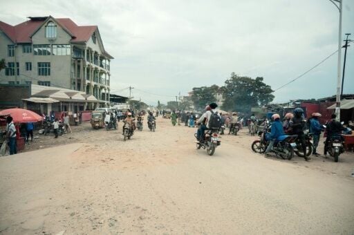 Passengers take to motorbike taxis in Uvira as the M23 militia and Rwandan troops close in