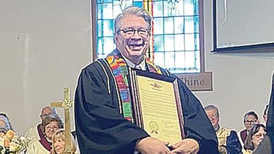 The Rev. Scott Lohse received a proclamation at his final service on Feb. 5.