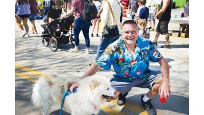 Bob Garmoe of De Soto visits the Fall Festival with Ariel, his 6-year-old dog.