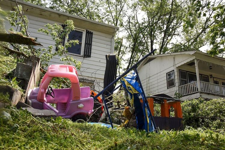 Toys sit in a yard after being blown from the storm