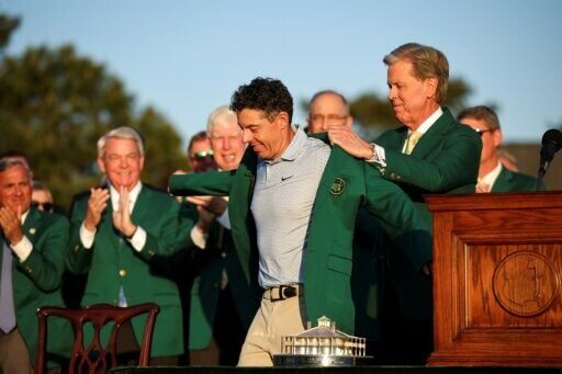 Rory McIlroy dons the green jacket after winning his second Masters in a row, forcing Augusta National chairman Fred Ridley to do the honor usually given to the prior year's champion