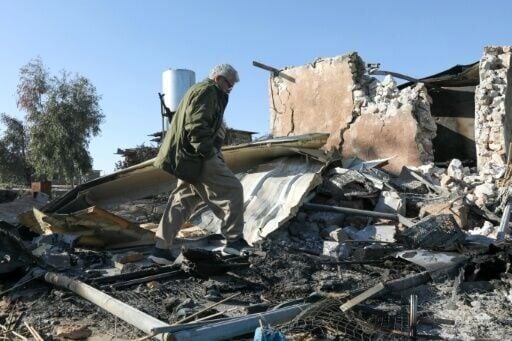 An Iranian Kurdish Peshmerga member of the Kurdistan Democratic Party of Iran inspects the damage sustained at the Azadi Camp following an Iranian cross-border attack in northern Iraq