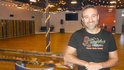 Tom Vogel, pictured, and his wife, Kristin Vogel, opened Tanglefoot Dance Hall in May.