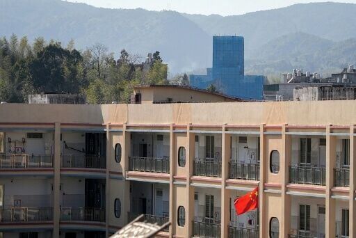The Yayang church (at rear) is seen covered in scaffolding in Yayang township, Wenzhou city