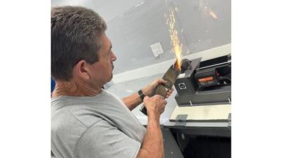 Dale Shrable of Dale’s Rapid Edge Sharpening in High Ridge demonstrates how he sharpens a blade.