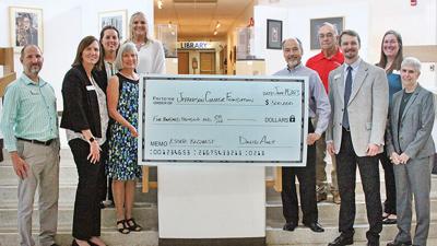 The Ault family presented a check for $500,000 to the Jefferson College Foundation June 14.