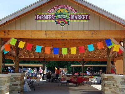 People shop at the Arnold Farmers Market during last year's salsa festival