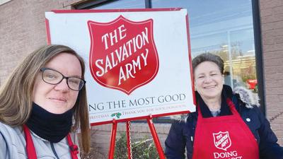 Jennifer Smith, left, with her mother, Judy Smith, ring bells at the Hillsboro Karsch’s Village Market.