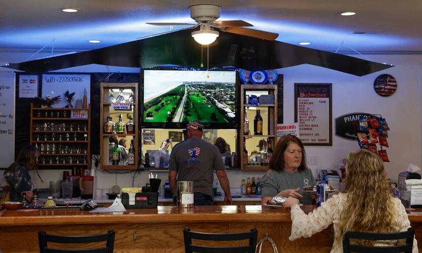 A model of a B-2 Bomber hangs over the bar