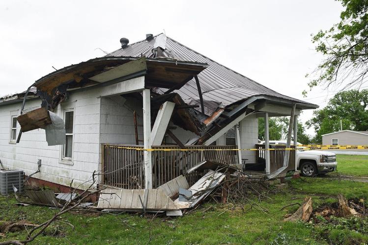 A roof caves in on a house after severe weather
