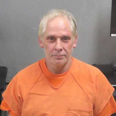 Fenton-area man allegedly fires crossbow, BB gun at vehicle; bites deputy