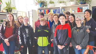 Volunteers from a local Latter-day Saints church help out the Ozark Food Pantry.