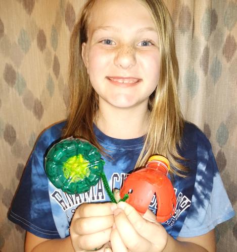 Savannah Swain plastic flowers.jpg