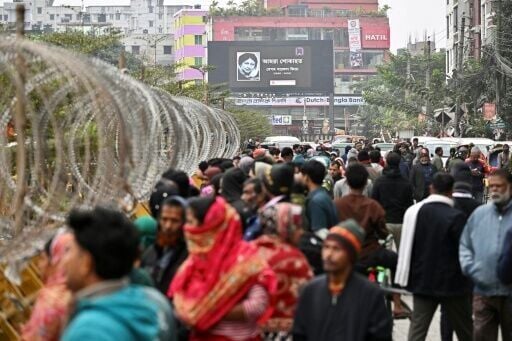 A billboard featuring the late Khaleda Zia outside the hospital in Dhaka where the former leader died