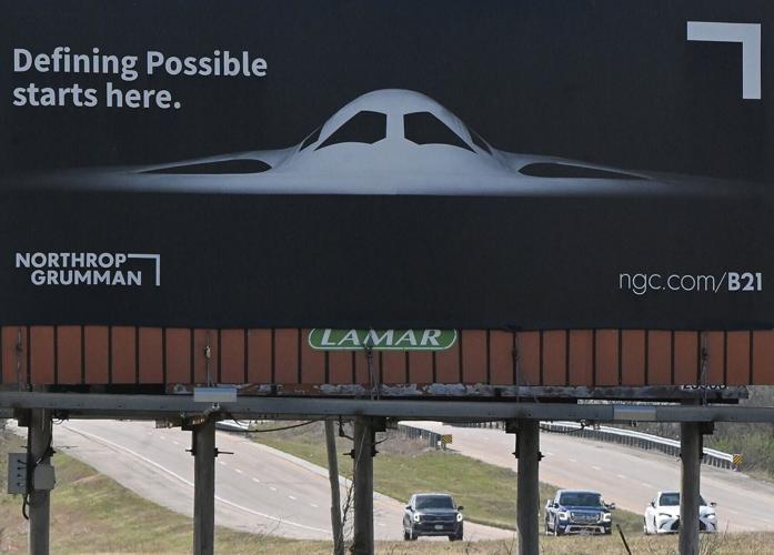 A billboard featuring Northrop Grumman sits near U.S. Highway 50