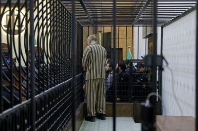 Najib appeared in court in Damascus in a striped prison jersey
