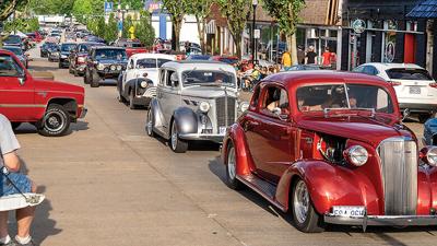 Vintage cars cruise Bailey Road/Main Street at the 2021 event.
