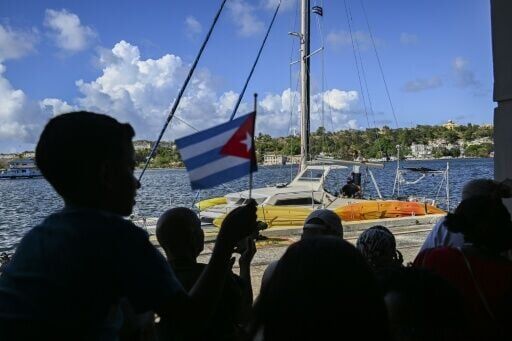 Scores of Cubans chanting 'long live the revolution' greeted the sailboats.