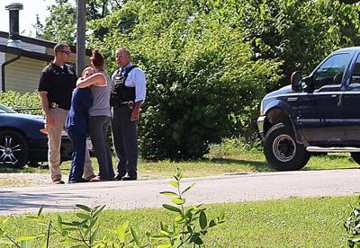 Two women talk to officers during standoff