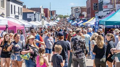 People visit local vendors and organizations on Festus Main Street during the Twin City Days Main Street Market on Sept. 7.