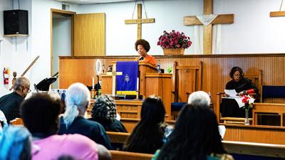 Jenoa Kinde reads the scripture during a worship service June 18 at Trinity Mount Carmel of Jefferson County Church in Festus.
