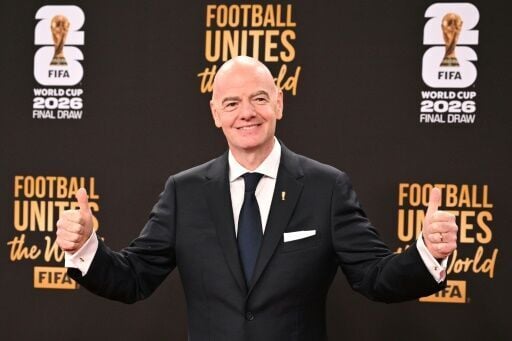 FIFA president Gianni Infantino poses on the red carpet before the draw for the 2026 World Cup