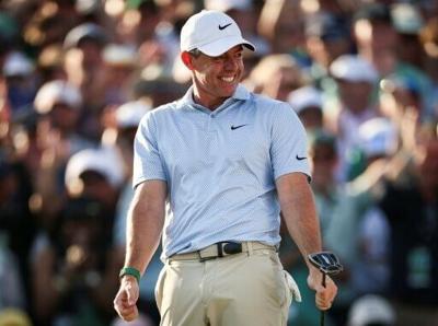 Rory McIlroy celebrates on the 18th green after winning his second consecutive Masters title and sixth career major crown