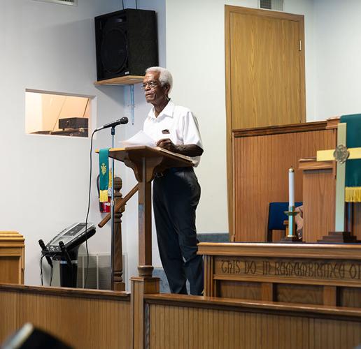 Michael Kinder reads a scripture on June 23 during the Quad City Juneteenth Homecoming.