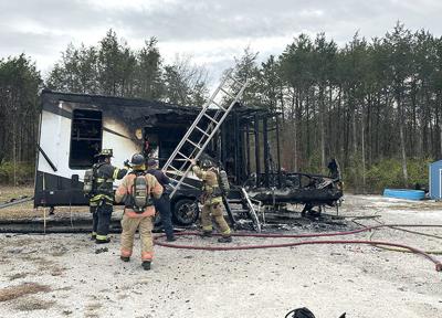 Fire destroys camper near De Soto