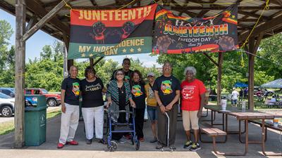 From left, Larry and Cheryl Houston of Festus, Bertha Kinder of Festus, James, Sharon and Kenny Riney of Crystal City and others gather for the Juneteenth Celebration picnic at South Adams Street Park.
