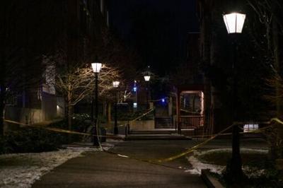 Police crime scene tape is seen near the site of a December 13 shooting at Brown University in Providence, Rhode Island, on December 15, 2025