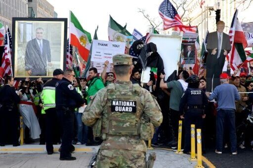 US security forces monitor demonstrators from the Iranian diaspora outside the White House as they protest the Iranian government