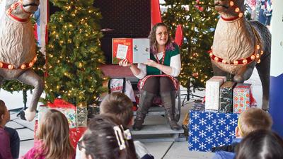 A representative from the Jefferson County Library Arnold branch read a story to children during the Christmas in the Park event last year at the Farmers Market near the entrance of Arnold City Park.