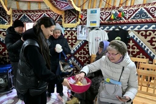 Left without heat in the middle of winter, Kyiv residents warm up in special tents set up by emergency services