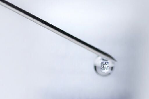 A syringe with a vial filled with Covid-19 vaccine. Negotiators have a week to complete the missing piece of the agreement