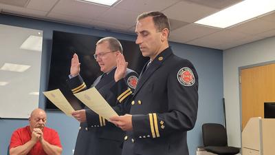 The Rock Community Fire Protection District’s Chuck Venegoni, left, and Jason Goebel have been promoted to captain, and their badge-pinning ceremony was held June 26 at House 5 in Arnold.