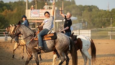 Riley Allen, 15, of Pacific, left, and Bailey Gibson, 15, of House Springs “celebrate” their elimination from the egg and spoon competition at the 2024 Hillsboro Horse Show.