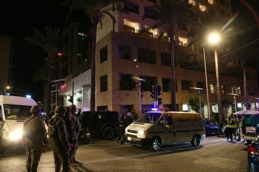 First aid responders gather at a Ramada hotel that Lebanon said was targeted by an Israeli strike, in Beirut's seaside Rawche area, on March 8, 2026