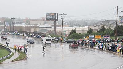 Hundreds of people protesting President Trump’s and Elon Musk’s actions lined Church Road over I-55 in Arnold on April 5.