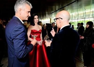 Newly-insetalled Disney CEO Josh D'Amaro, shown here with Anne Hathaway and Stanley Tucci at the world premiere of The Devil Wears Prada 2 in New York, described consumer demand as solid but said the company is aware of concerns about geopolitics