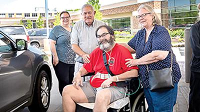 Mark Holman leaves the hospital after a five-month stay.