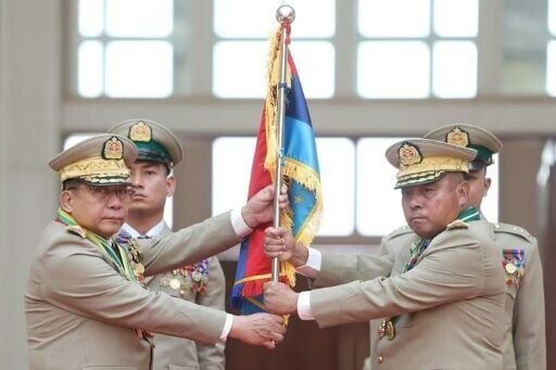 Myanmar cleared the way for coup-leading general Min Aung Hlaing (L) to become president and maintain his rule in civilian garb