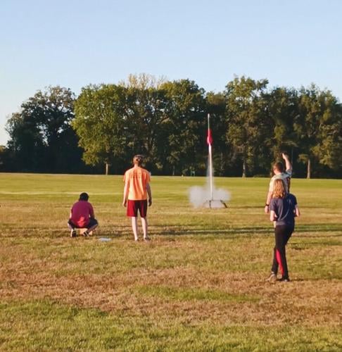 Seckman Middle School rocketry team members execute a practice launch.