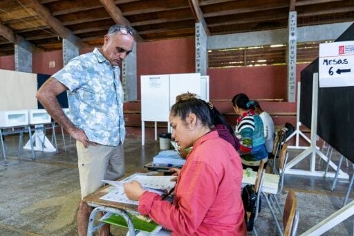 A man queues to vote during the general election, in Rapa Nui / Eastern Island, Chile on November 16, 2025